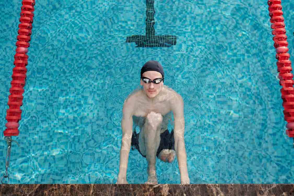 A disabled man swimming.