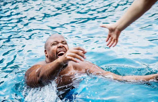 Man being rescued from the water Free Photo