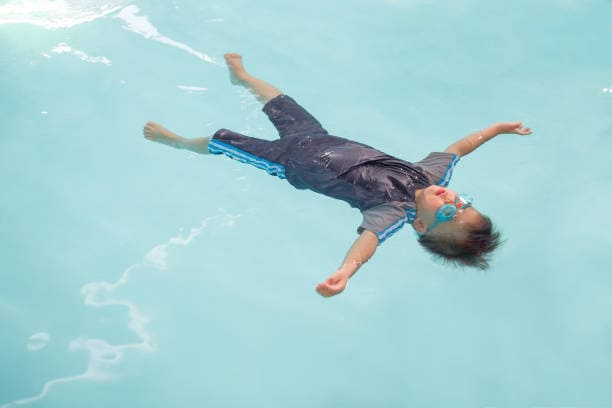 floating in water while swimming