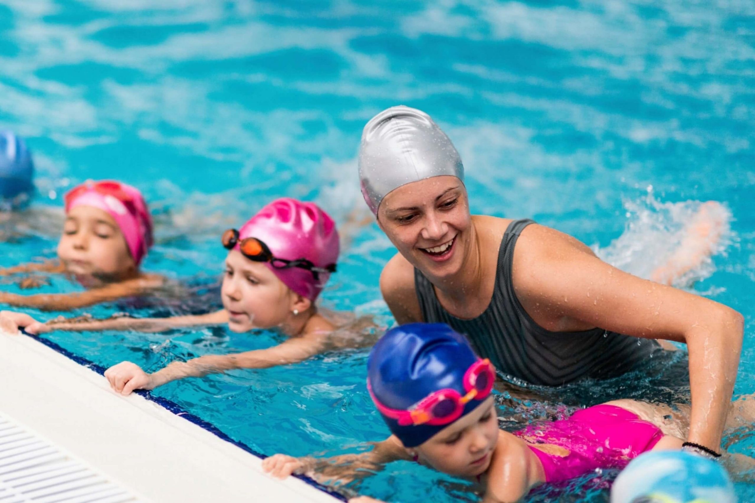 coach in training the kids in their swimming lesson in miami