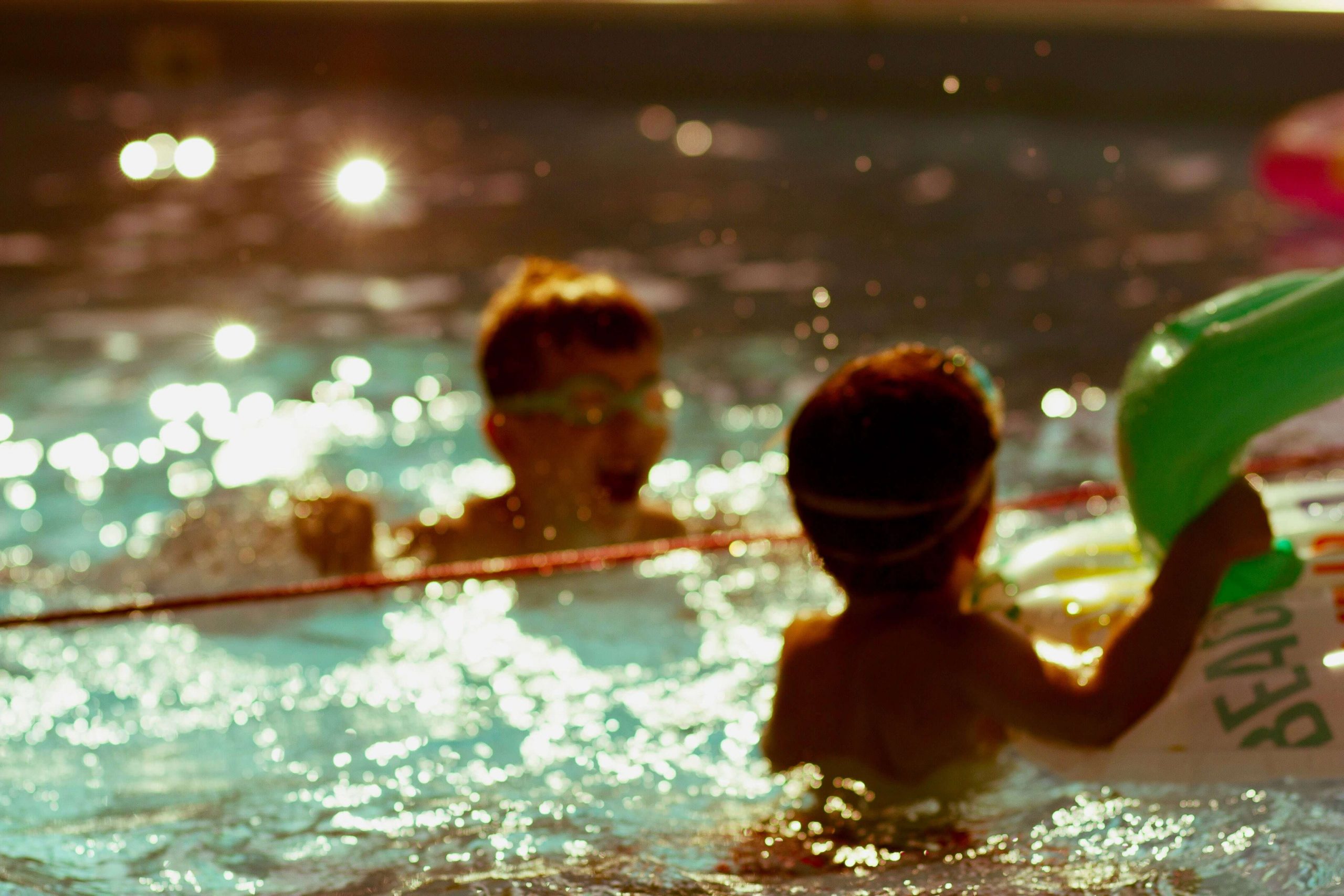 Little infants enjoying their surfside swimming lessons in the pool